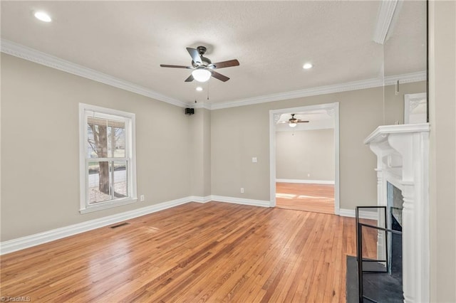 interior space featuring light hardwood / wood-style floors, ceiling fan, and ornamental molding