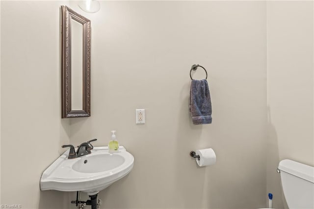 bathroom with toilet and sink