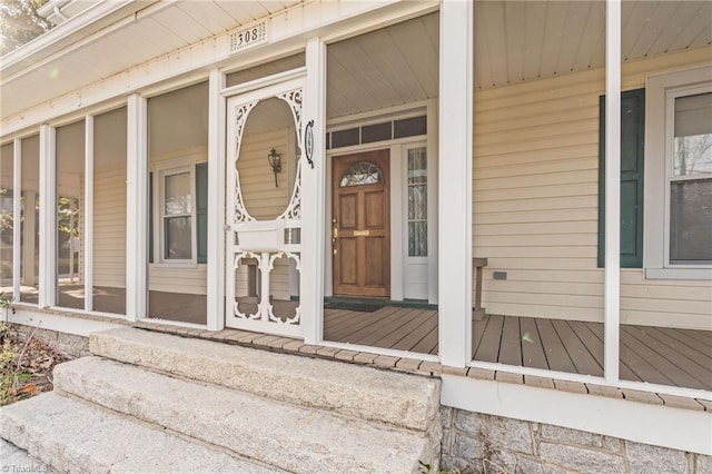 doorway to property featuring a porch