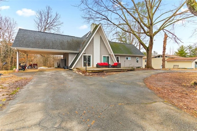 view of front of home with a carport