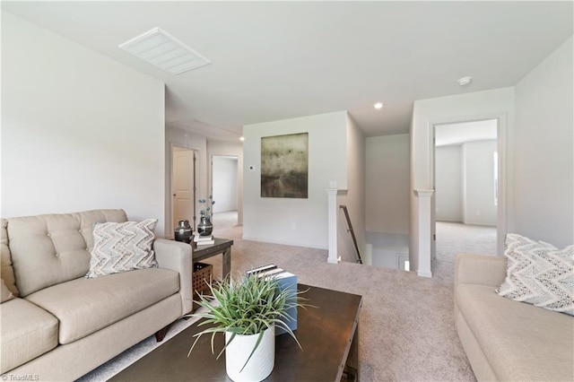 carpeted living room featuring visible vents and recessed lighting