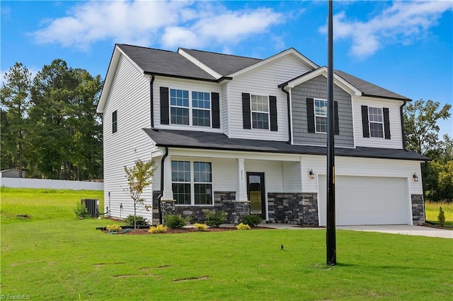 craftsman-style home with concrete driveway, stone siding, an attached garage, cooling unit, and a front lawn