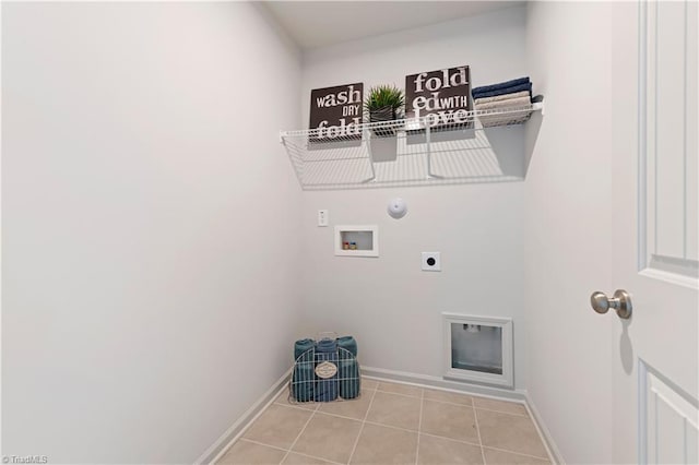 washroom with laundry area, light tile patterned floors, hookup for a gas dryer, hookup for a washing machine, and hookup for an electric dryer