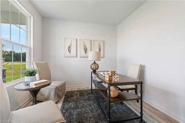 office area featuring baseboards and wood finished floors