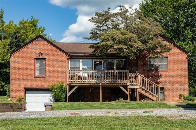 view of front of home with a garage and a front lawn