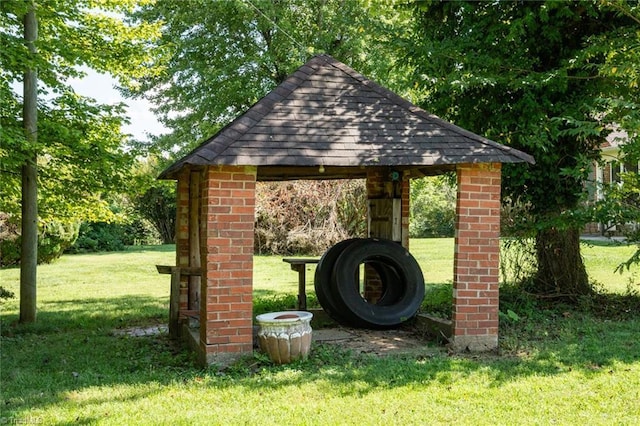 exterior space featuring a gazebo and a yard