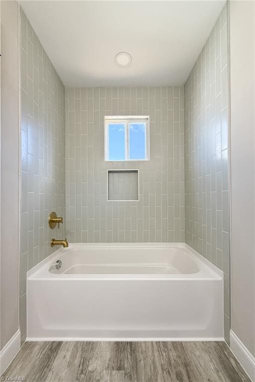 bathroom featuring wood finished floors and baseboards