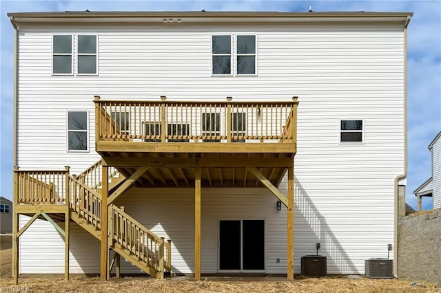 rear view of property featuring stairs, a deck, and central air condition unit