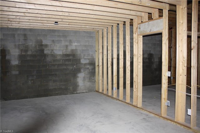 interior space with concrete block wall