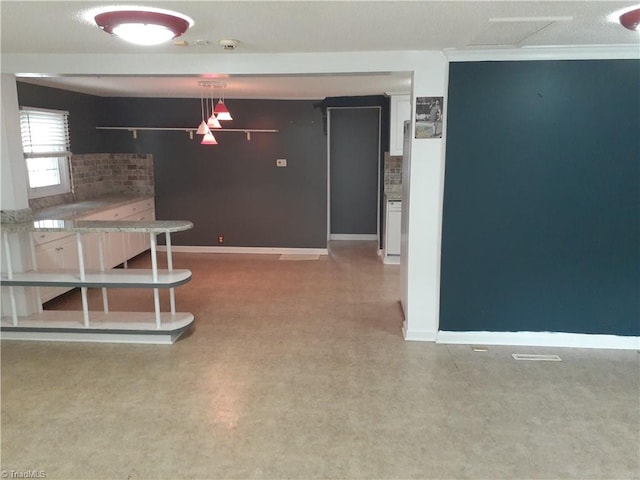 kitchen featuring crown molding