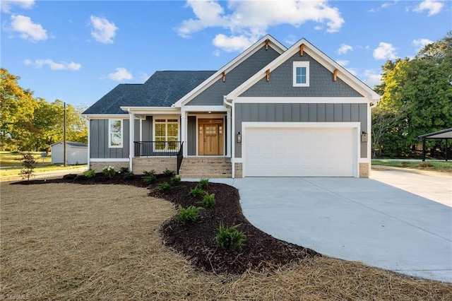 view of front of house featuring covered porch and a garage