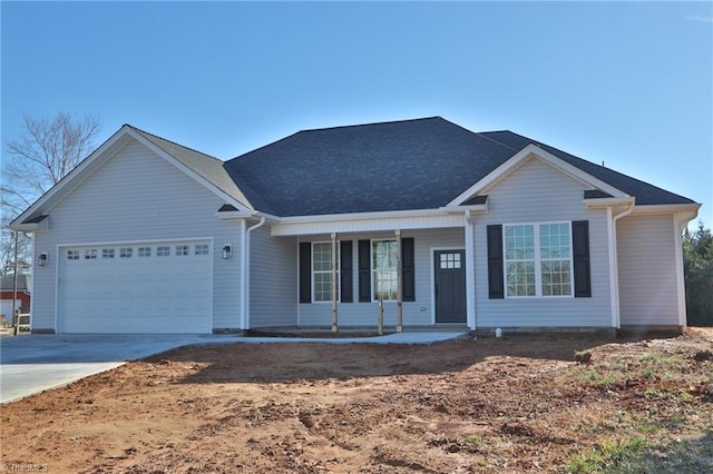 single story home with a porch and a garage