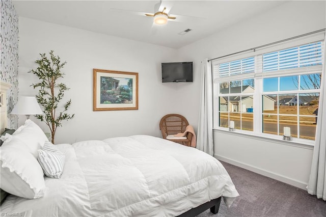 bedroom with ceiling fan and carpet floors