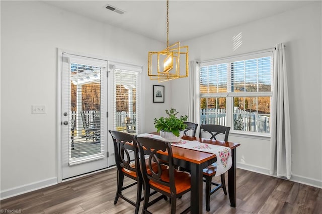 dining room with dark wood-type flooring