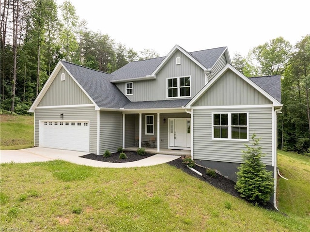 2578 Whipporwill Ct, Rural Hall, NC 27045 - view of front facade with an attached garage, a porch, a shingled roof, and concrete driveway