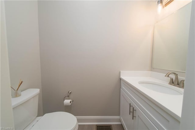 2578 Whipporwill Ct, Rural Hall, NC 27045 - half bathroom featuring toilet, vanity, and baseboards
