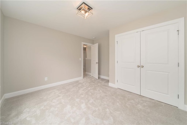 2578 Whipporwill Ct, Rural Hall, NC 27045 - unfurnished bedroom featuring light colored carpet, baseboards, and a closet