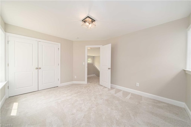 2578 Whipporwill Ct, Rural Hall, NC 27045 - unfurnished bedroom with light colored carpet, baseboards, and a closet