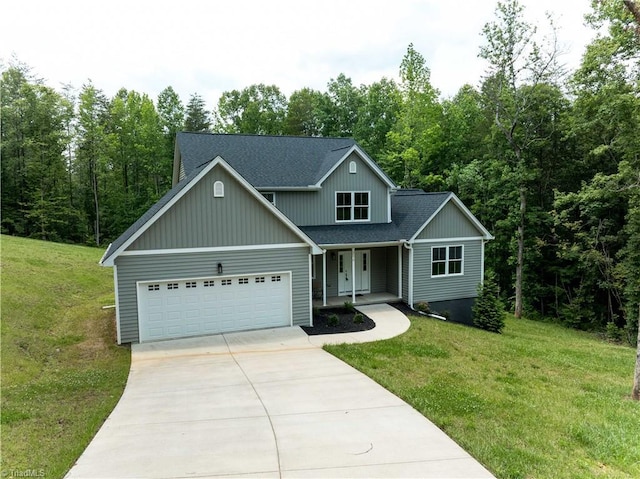 2578 Whipporwill Ct, Rural Hall, NC 27045 - traditional home with a porch, concrete driveway, an attached garage, and a front yard