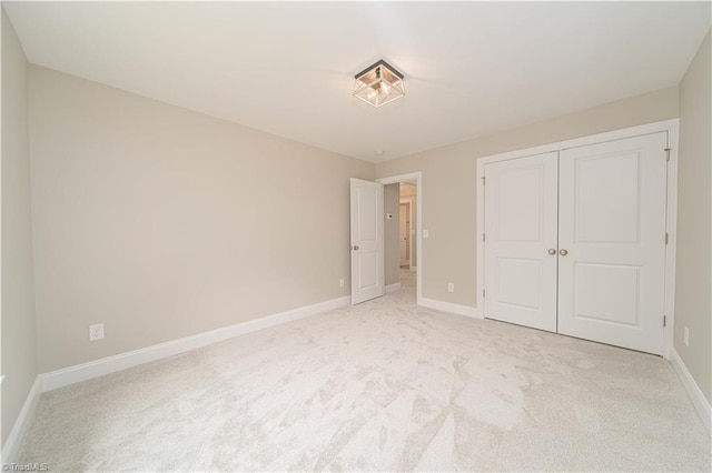 2578 Whipporwill Ct, Rural Hall, NC 27045 - unfurnished bedroom with light colored carpet, baseboards, and a closet