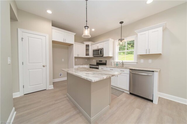 2578 Whipporwill Ct, Rural Hall, NC 27045 - kitchen with appliances with stainless steel finishes, a sink, light wood-type flooring, white cabinetry, and recessed lighting
