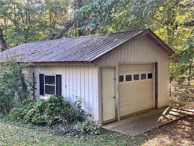 garage featuring wood walls