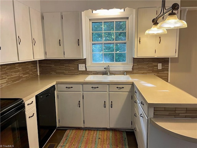 kitchen featuring black appliances, white cabinetry, hanging light fixtures, and sink