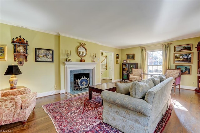 living room featuring ornamental molding and hardwood / wood-style flooring