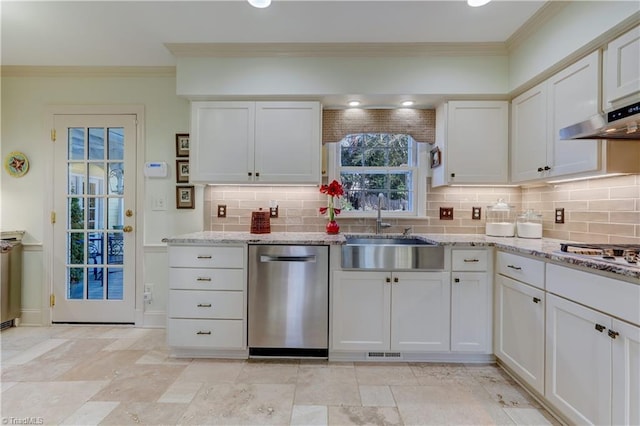 kitchen featuring white cabinetry, sink, light stone countertops, and stainless steel appliances