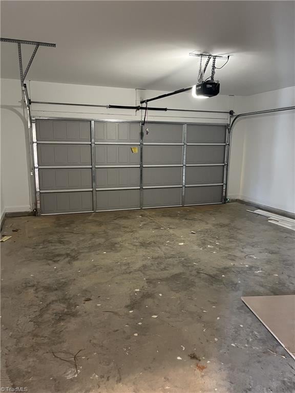 garage featuring a garage door opener