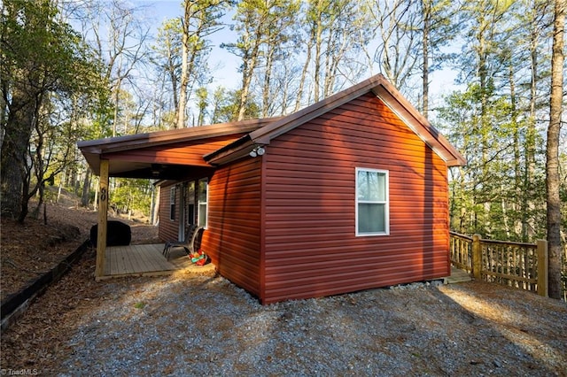 view of property exterior featuring a deck