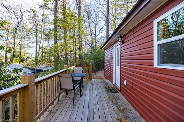 wooden deck with outdoor dining space