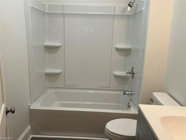 bathroom with vanity, toilet, and shower / washtub combination