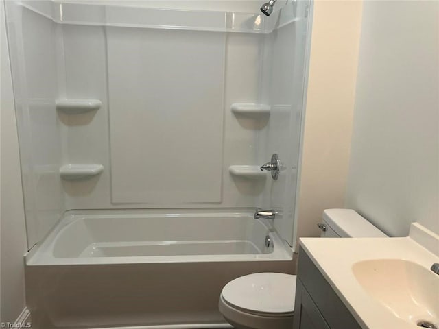 bathroom with toilet, vanity, and shower / bathing tub combination