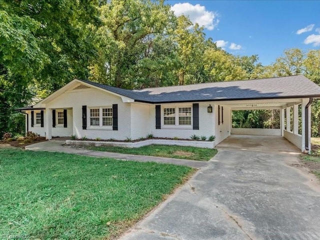 ranch-style house with a front yard and a carport