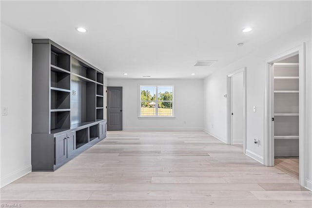 unfurnished living room featuring light wood-type flooring