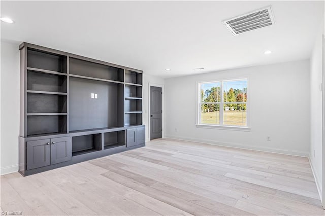 unfurnished living room featuring light wood-type flooring