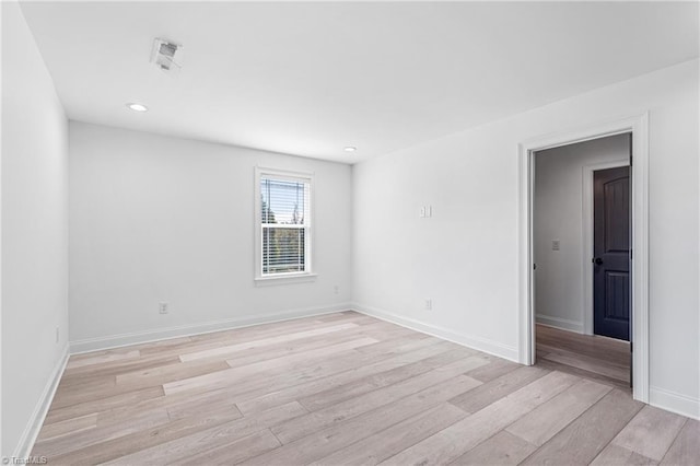 unfurnished room featuring light hardwood / wood-style flooring