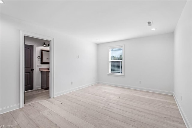 unfurnished room featuring light hardwood / wood-style flooring