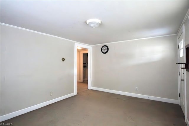 spare room featuring baseboards