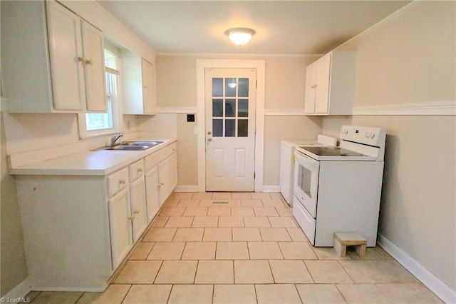 kitchen with light countertops, electric range, white cabinetry, and a sink