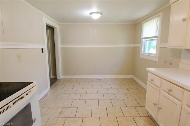 unfurnished dining area featuring ornamental molding and visible vents