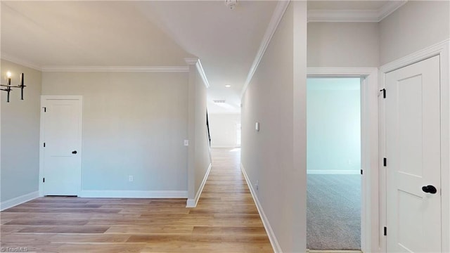 3043 Loch Dr, Winston-Salem, NC 27106 - hallway featuring ornamental molding, baseboards, and light wood-style flooring