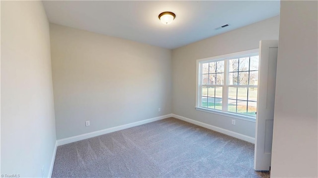 3043 Loch Dr, Winston-Salem, NC 27106 - spare room featuring carpet and baseboards
