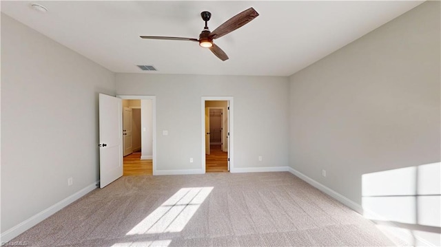 3043 Loch Dr, Winston-Salem, NC 27106 - unfurnished bedroom with light carpet, baseboards, and ceiling fan