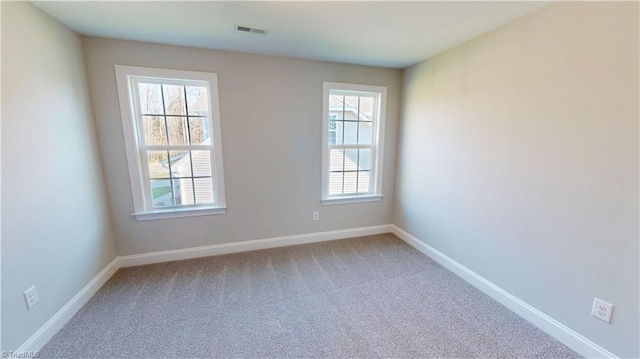 3043 Loch Dr, Winston-Salem, NC 27106 - spare room with plenty of natural light, light carpet, and baseboards