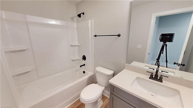 3043 Loch Dr, Winston-Salem, NC 27106 - full bath with toilet, vanity, shower / washtub combination, and wood finished floors