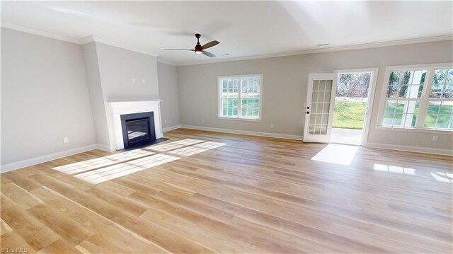 3043 Loch Dr, Winston-Salem, NC 27106 - unfurnished living room with healthy amount of natural light, crown molding, baseboards, a fireplace with flush hearth, and light wood finished floors