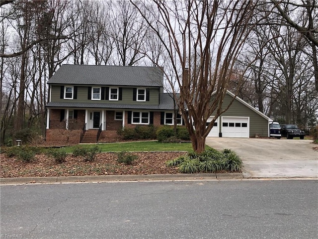 view of front of home featuring concrete driveway, brick siding, and an attached garage