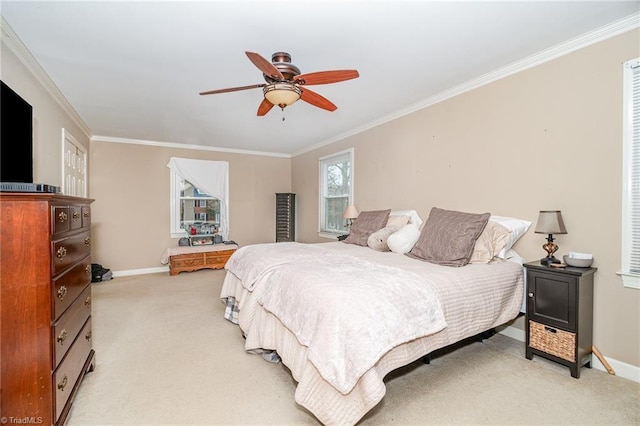 bedroom with ornamental molding, baseboards, and light carpet